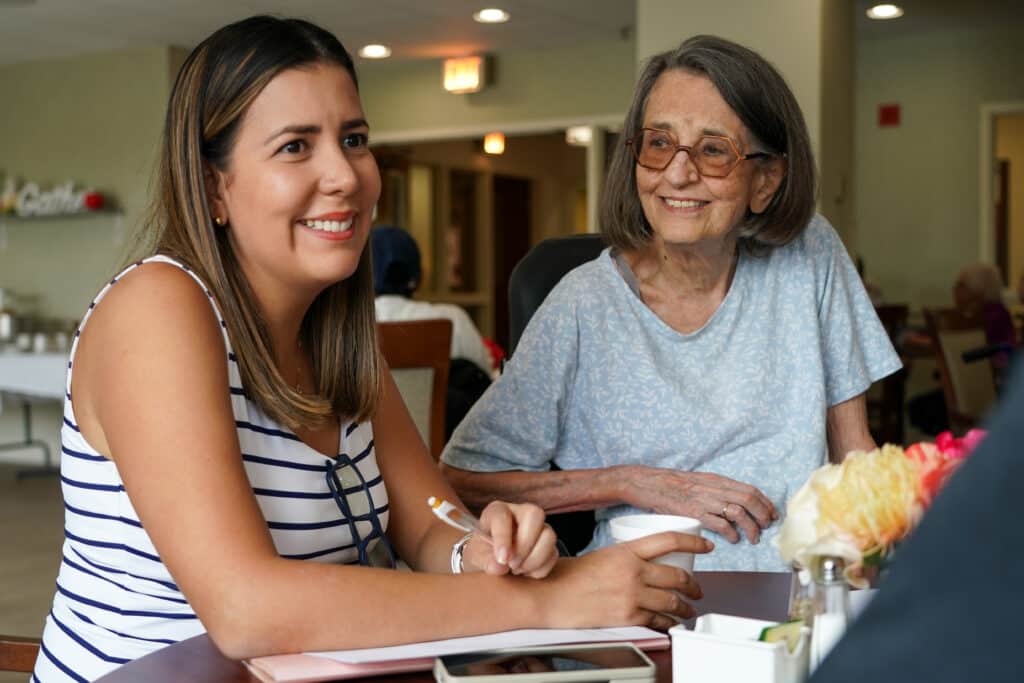 Nancy Eustis, right, talks with Cata Ricon of Colombia